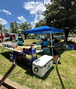 A food table being set up for Pickens&rsquo; Community Health Fair at the Tom Bevill Lock and Dam in Pickensville, AL.